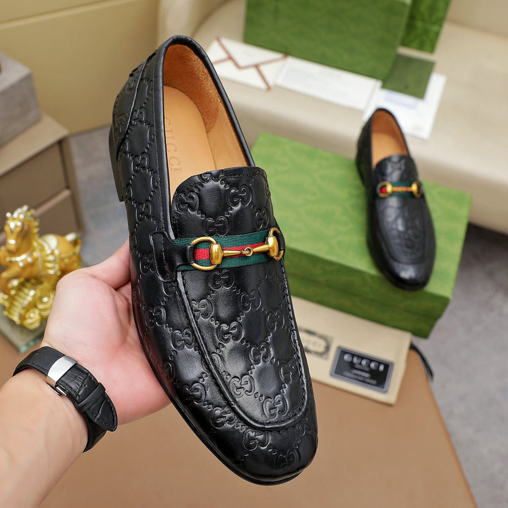 Gucci Patterned Metal-Bit Loafers — model